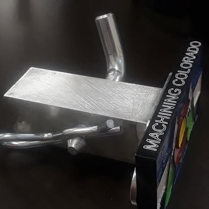 A machined aluminium bar beside the Colorado flag hitch cover